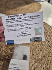 Listing image for Certified Meteorite 1.9 grams Specimen In Display Box